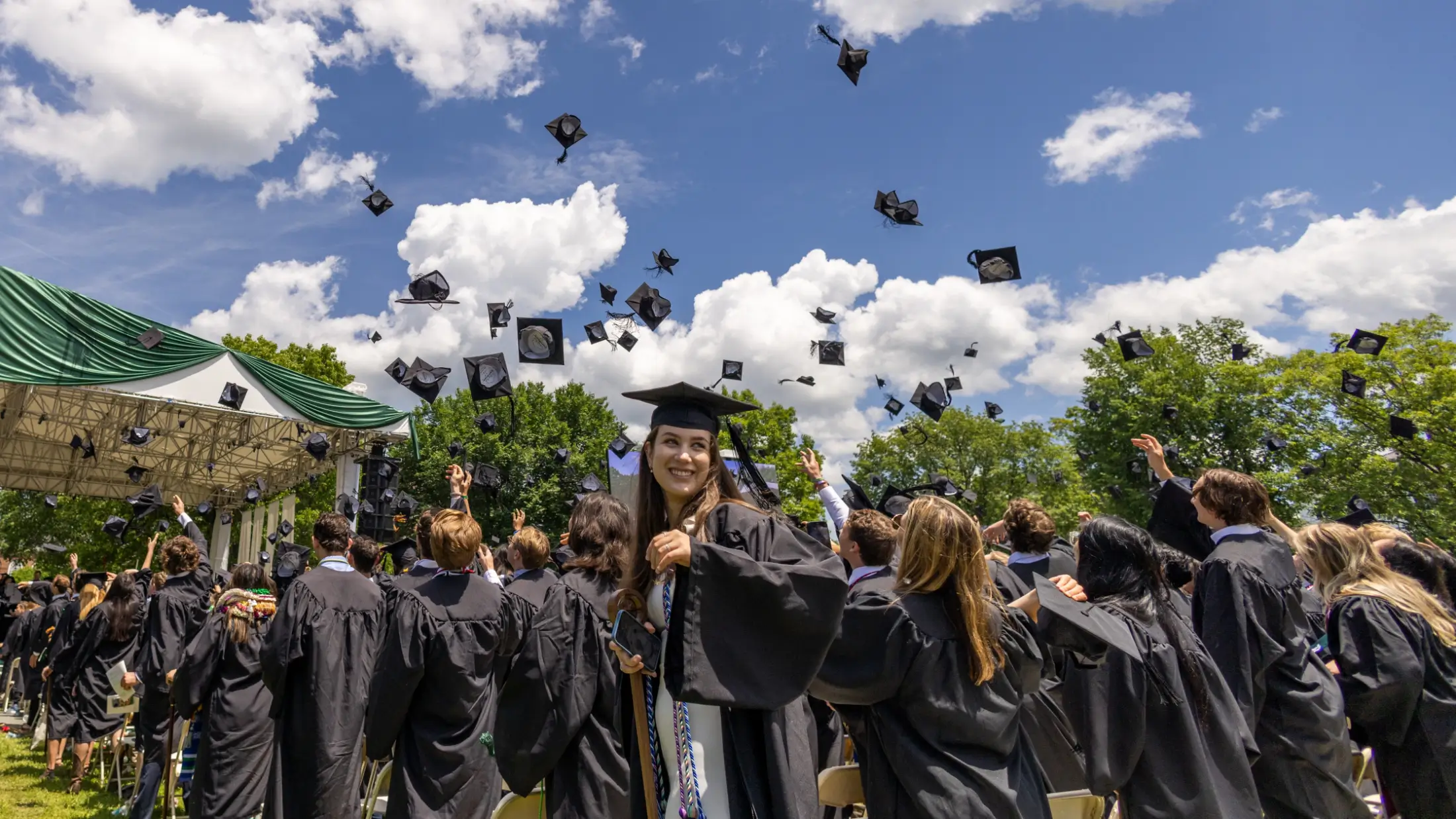 Dartmouth College graduates celebratory cap throw on the Green in Hanover New Hampshire.