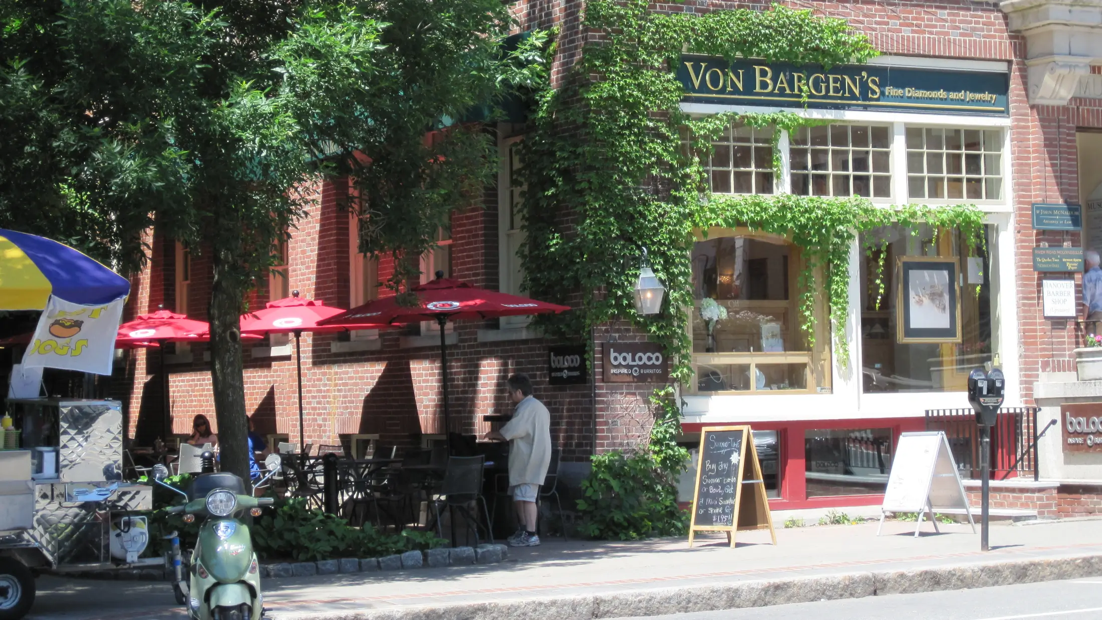 Summertime outdoor diners at a restaurant in downtown Hanover, New Hampshire.