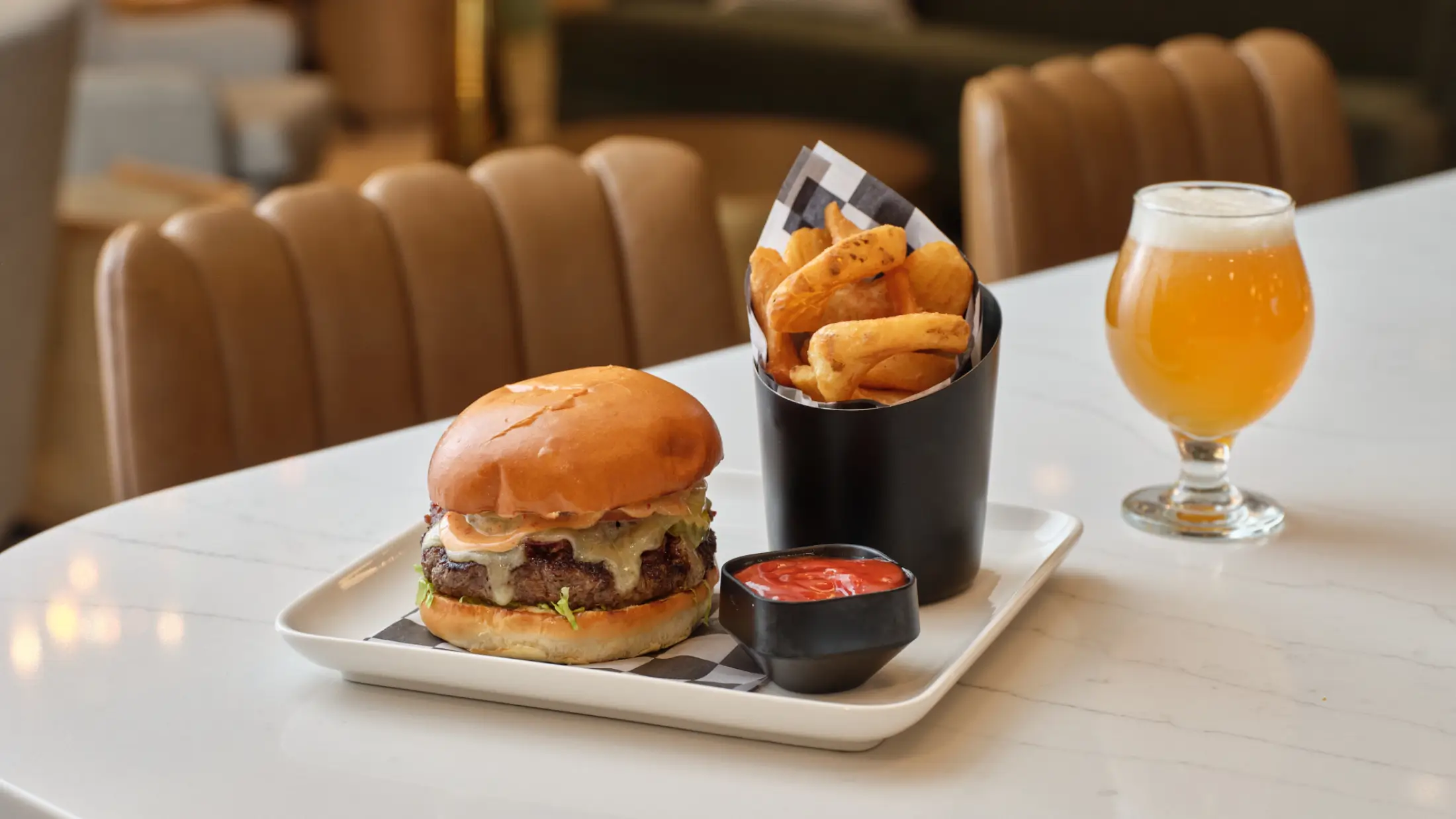 Juicy hamburger, crisp hot French fries, and a cold microbrew served at Six South St Hotel, Hanover, New Hampshire.