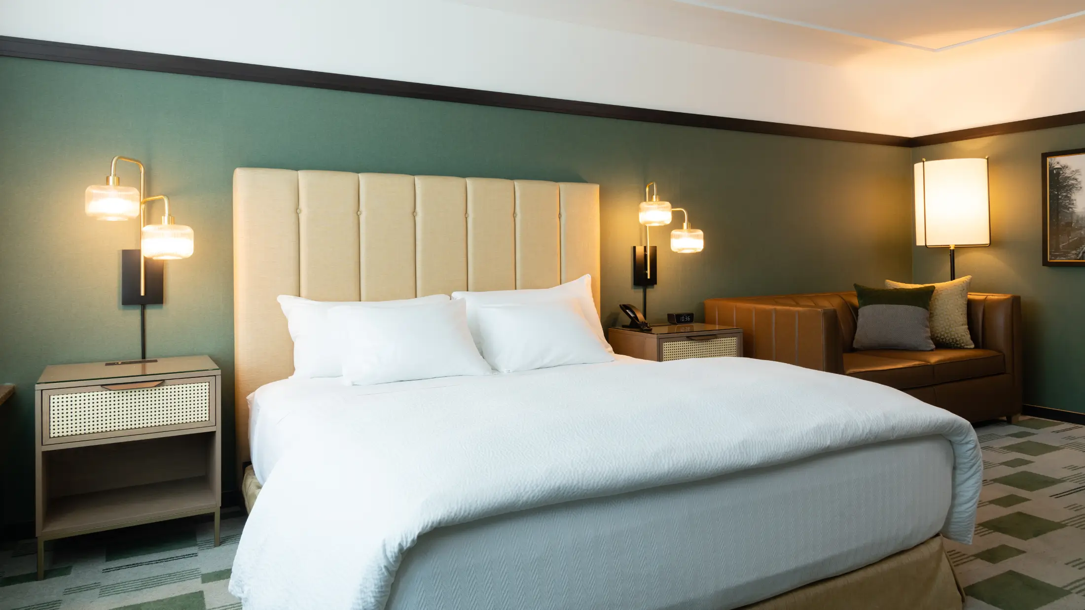 Deluxe king bed, premium linens, and tuxedo style at Six South St Hotel in Hanover, NH.