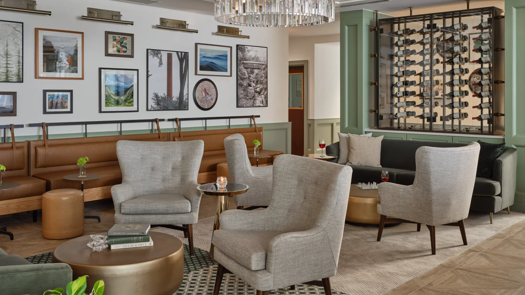 Art wall and wine bottle display create welcoming setting in Six South St Hotel lounge.